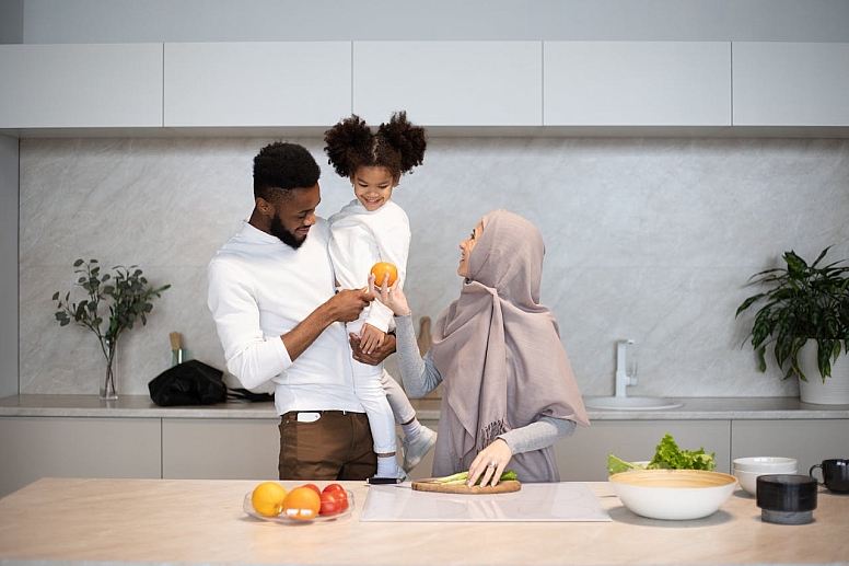 content muslim family together in kitchen